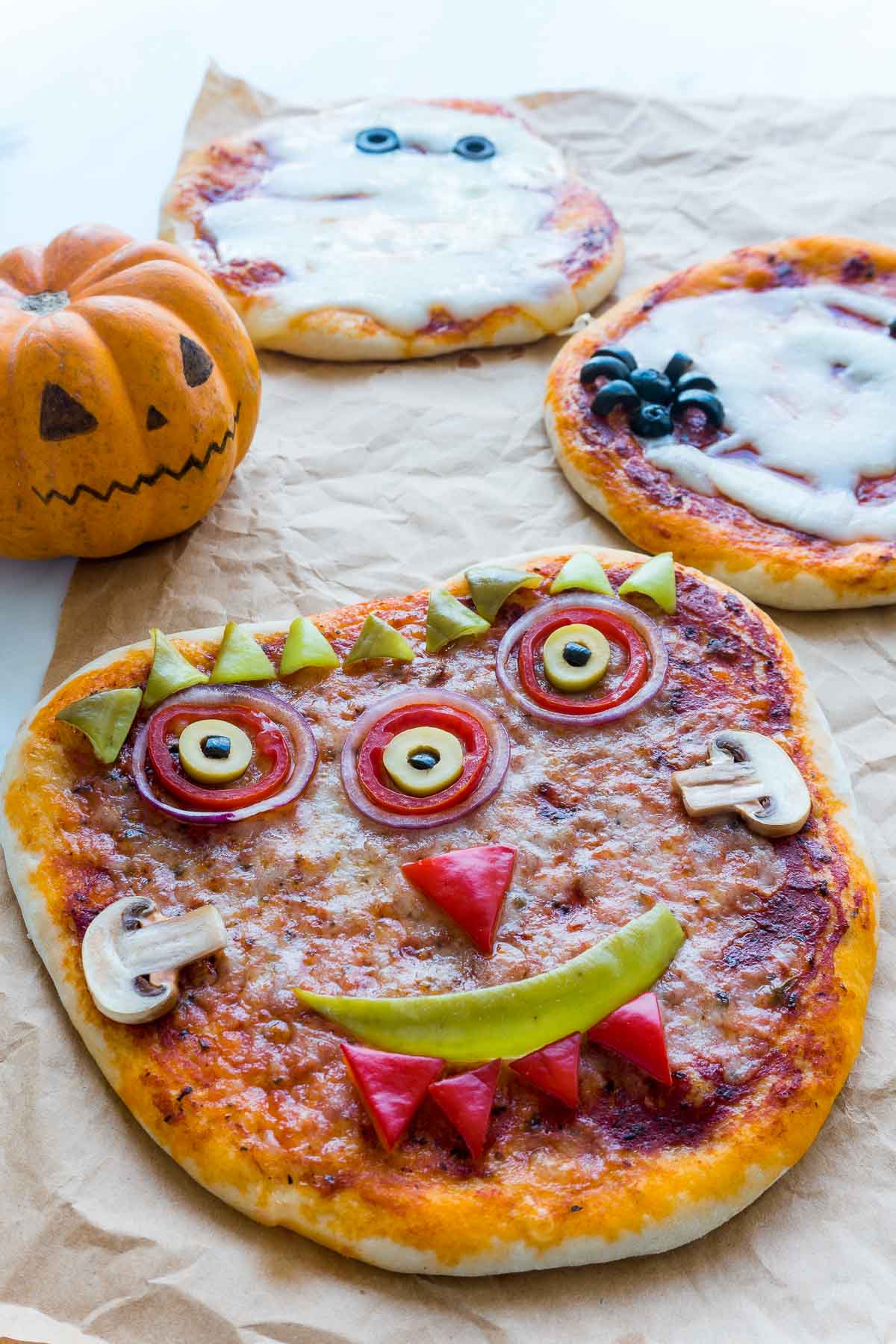 A pizza that uses cheese to create a spider's web, and olives to create spiders.