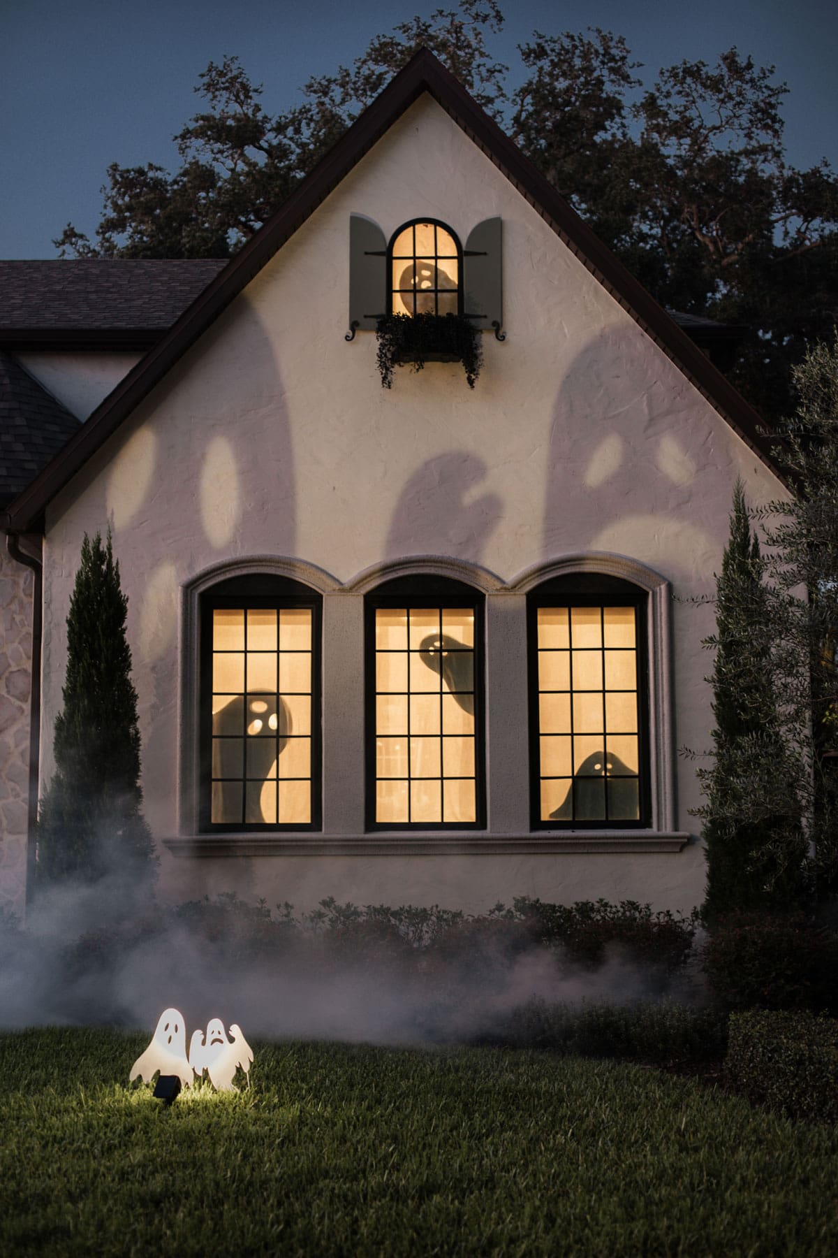 halloween ghost shadows projected on house